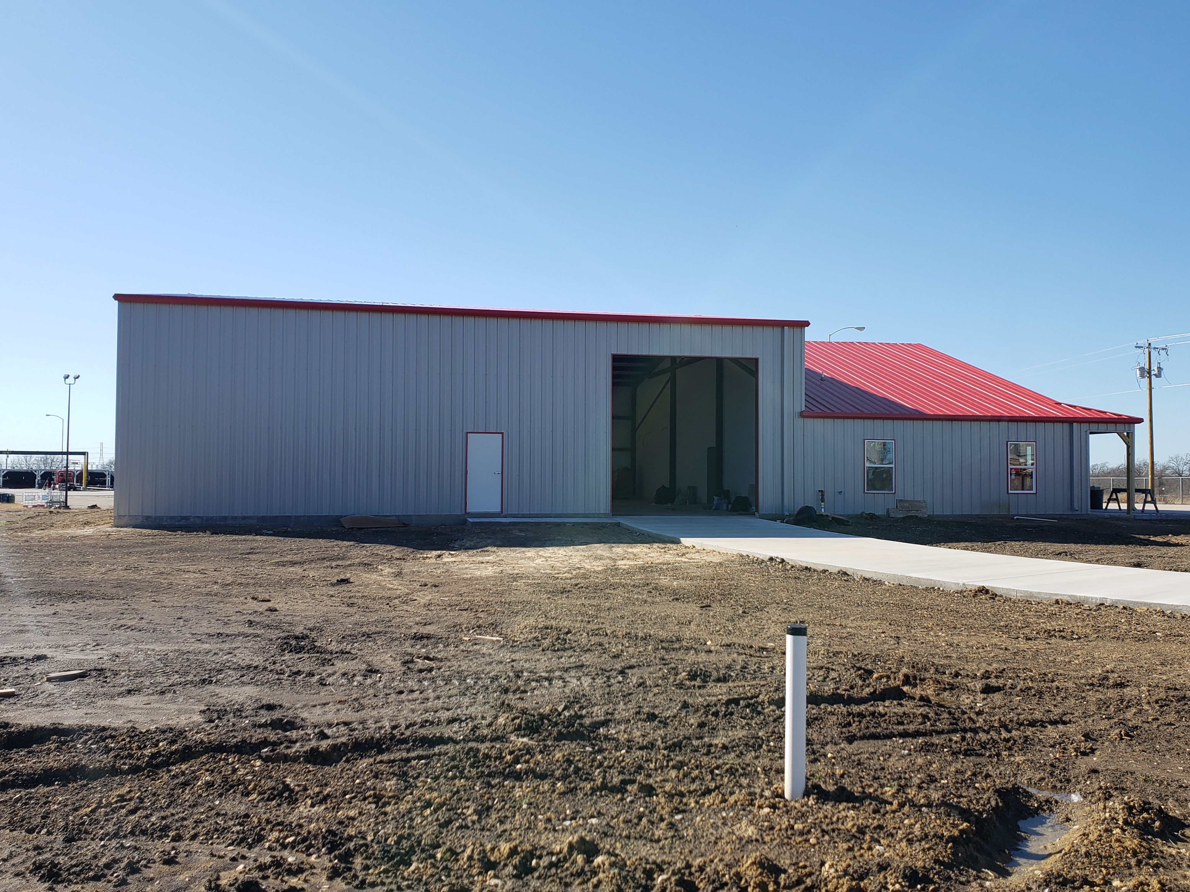 Office with shop building showing the large shop opening